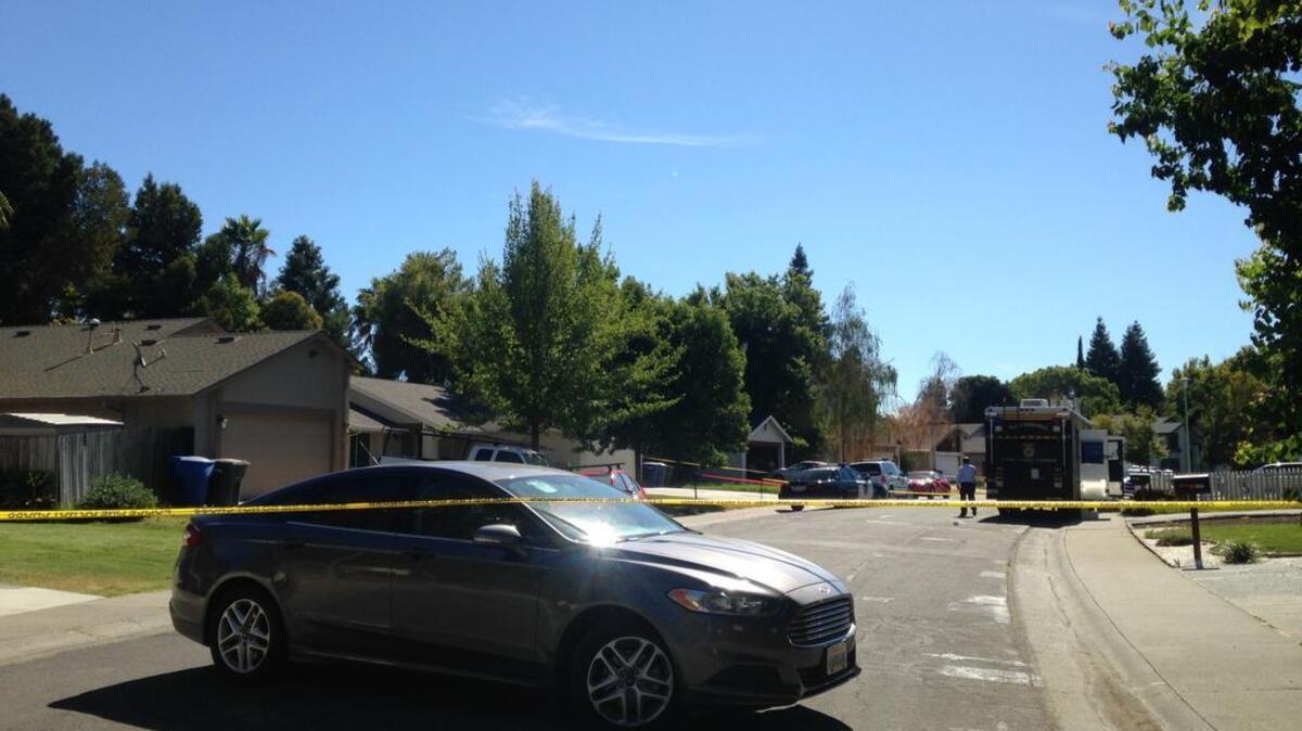 
Police have taped off the scene where a body was found in the backyard of a house in the 1300 block of Trail End Way on Thursday. 
