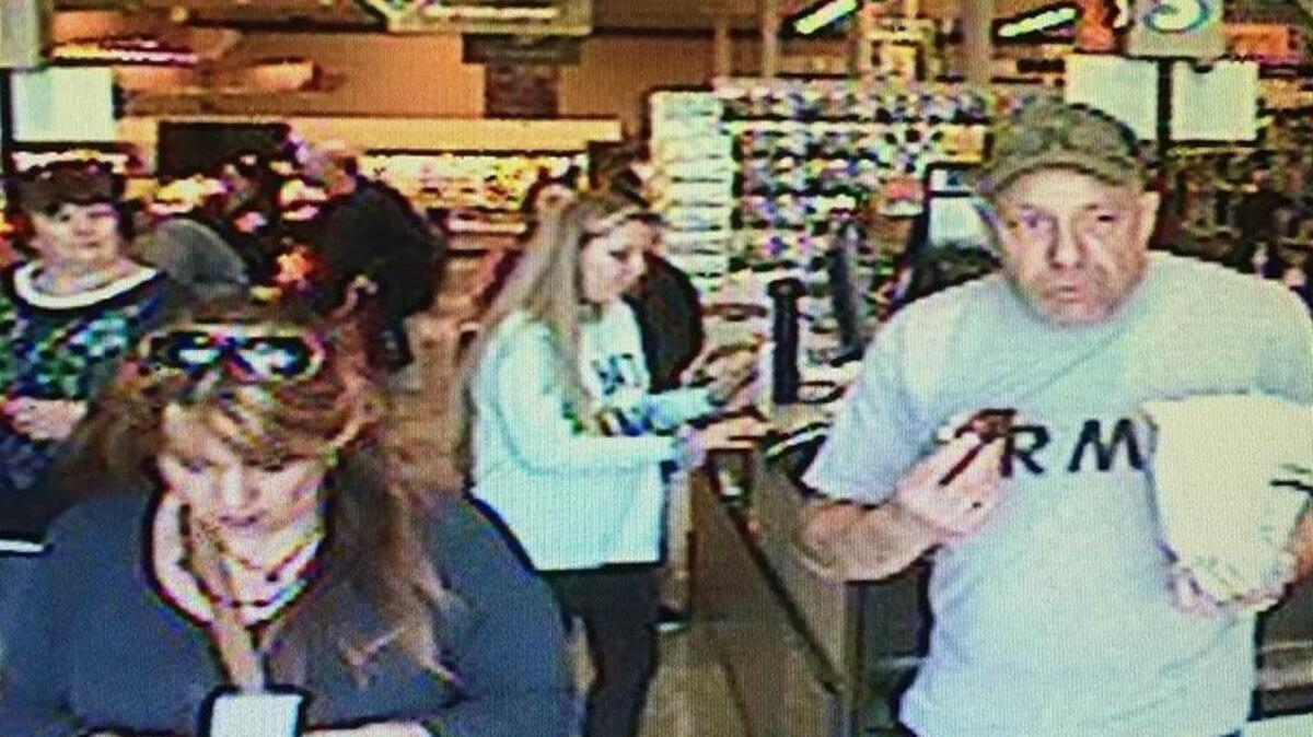 Davis police seek to identify the man and woman shown in this surveillance photo. They are suspected of using stolen credits cards at local businesses.