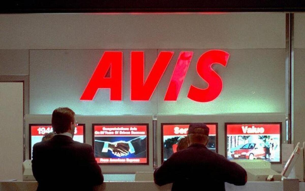 Rental car customers are helped at the Avis counter located in the New Hanover International Airport in Wilmington, N.C.