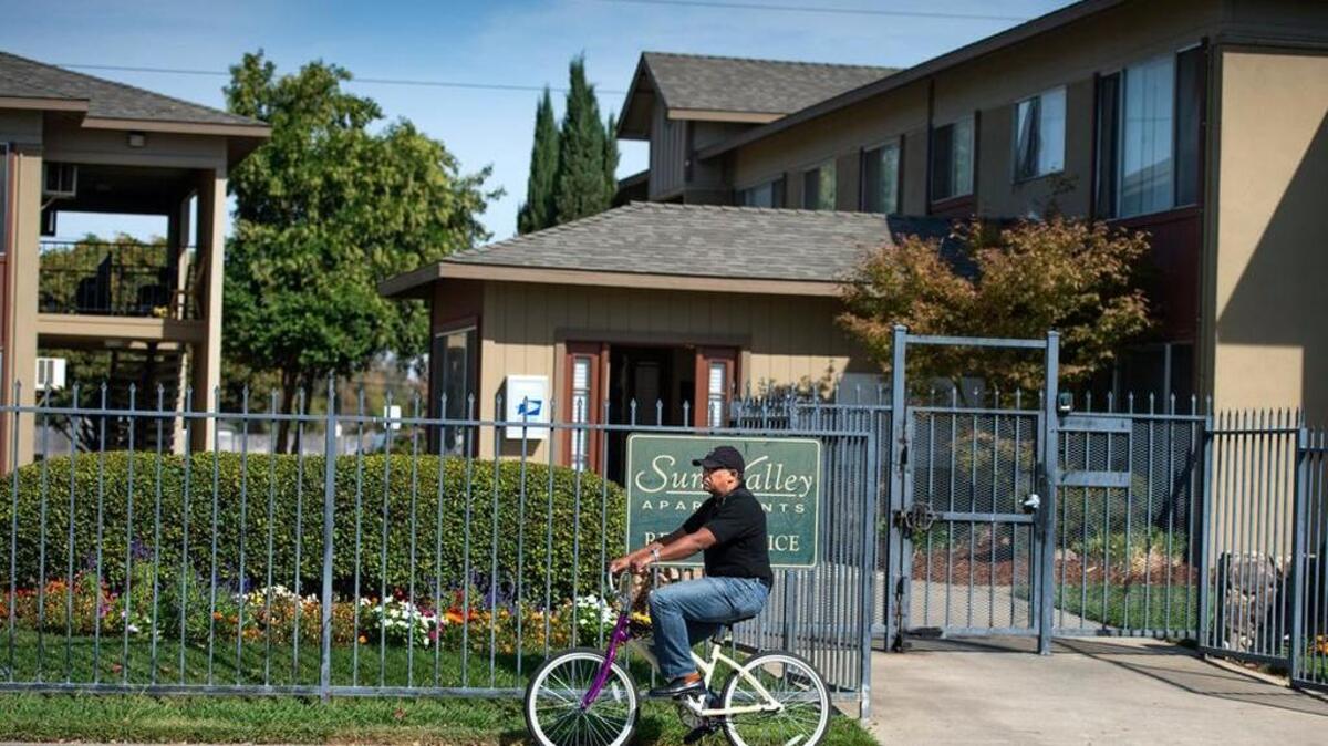 
A bicyclist rides in front of the apartment complex Wednesday, Oct. 7, 2015, where Frank Davis Knight, 58, was shot and killed Monday. Knight had kept a steady routine of going to work every day at Goodwill Industries and was identified as the person who was shot to death in southern Sacramento County.
