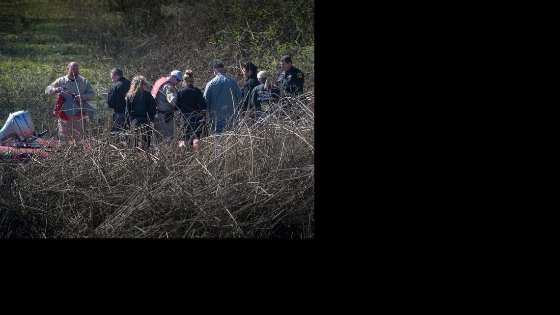 
Yolo County investigators prepare to leave the scene where the lifeless body of 20-day-old Justice Rees was found Wednesday morning. County sheriff’s and coroner’s spokesman Capt. Larry Cecchettini said the baby’s body was “located in a thicket of brush right off the slough.” 
