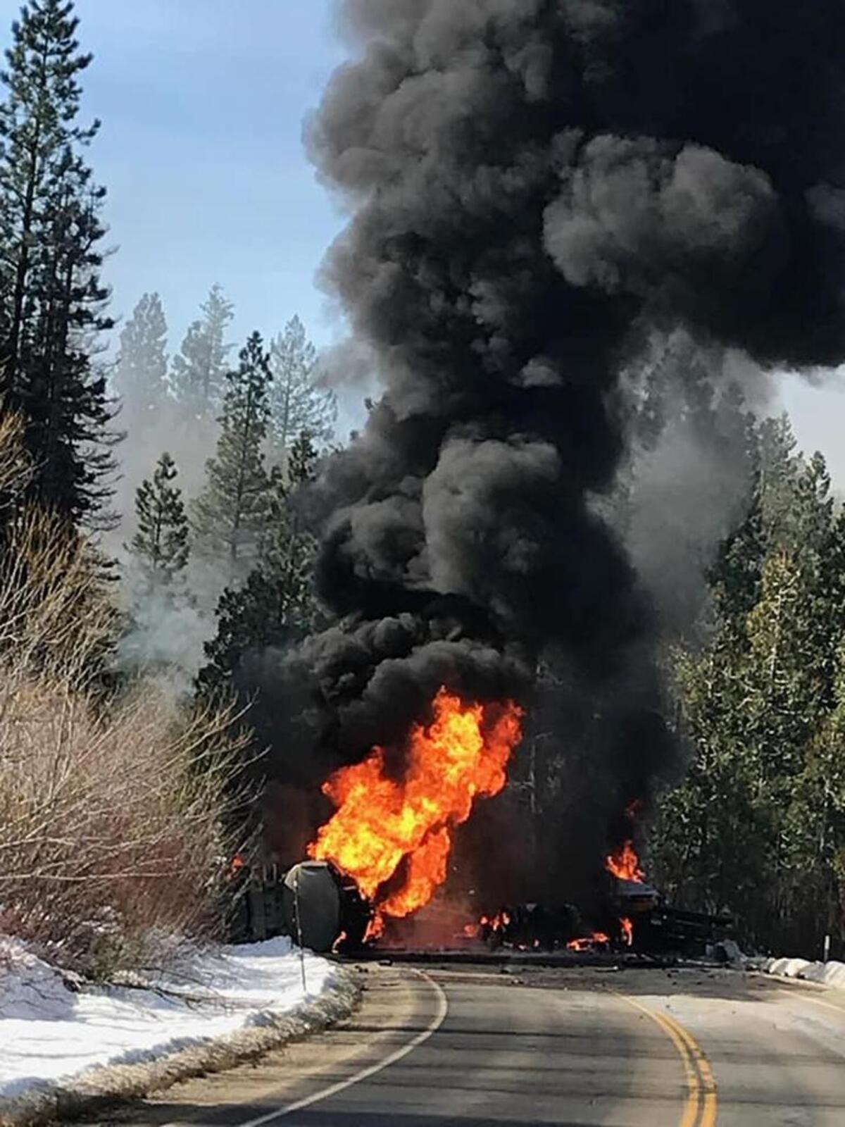 A fuel tanker is engulfed in flames after a head-on collision with a tow truck Wednesday morning about six miles west of the Interstate 80/Highway 20 Yuba Gap junction.