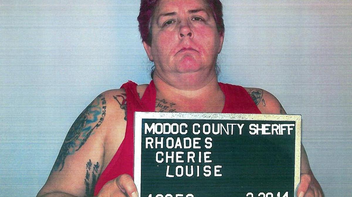 This Thursday, Feb. 20, 2014 photo released by Alturas Police Department shows Cherie Lash Rhoades. Rhoades, convicted of killing four people at the headquarters of an Indian tribe that was evicting her and her son from its land, had been under federal investigation over at least $50,000 in missing funds, a person familiar with the tribe's situation told The Associated Press.