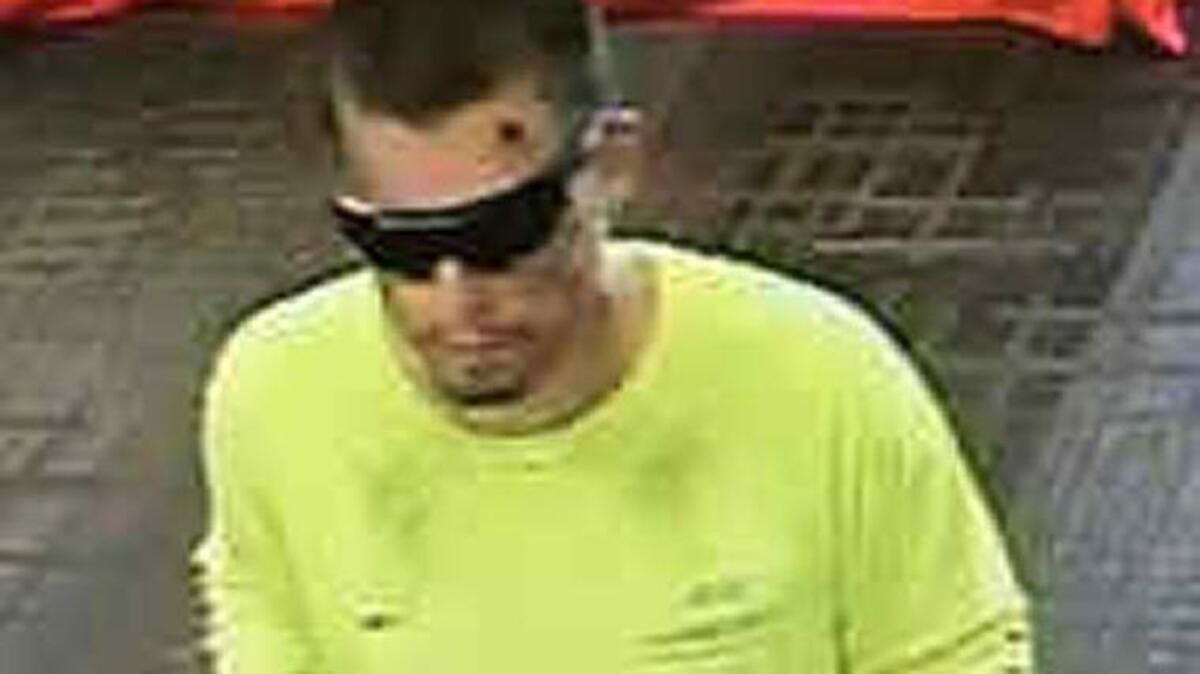 A surveillance photo shows a man suspected of robbing a Bank of America in Roseville.