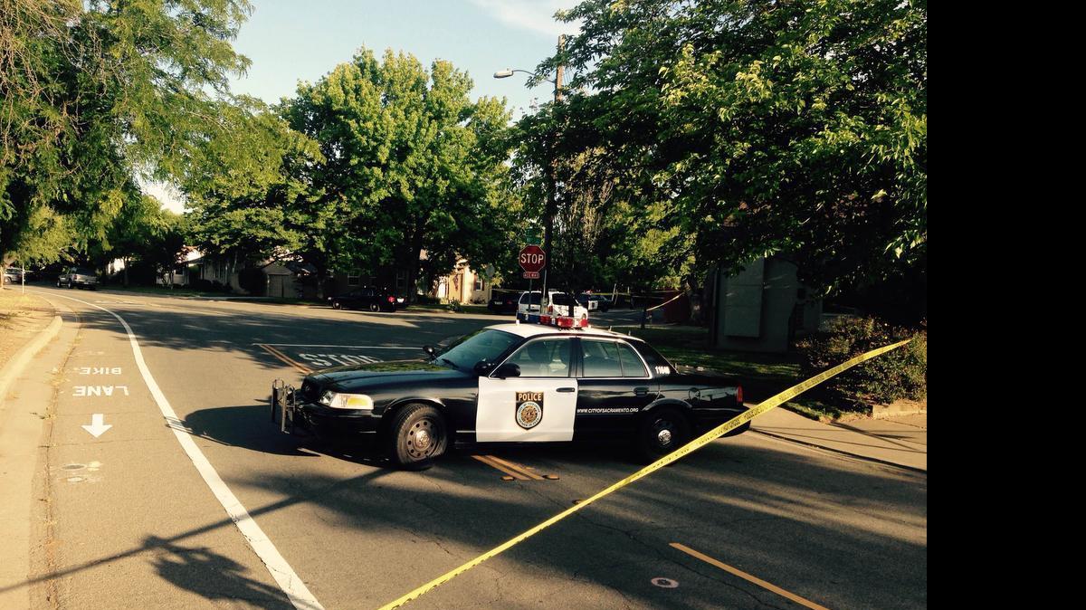 
Sacramento Police taped off an area at 61st and T streets near a shooting scene in May. 
