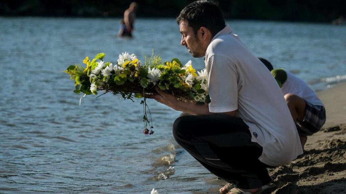 
Purna Paudel has a moment of thought before sending a wreath into the confluence of the Sacramento and American rivers during a vigil for his wife, Aasha Sharma, a 27-year-old woman from Sacramento who drowned in July off a beach near Discovery Park, the same spot where a young man drowned last week.
