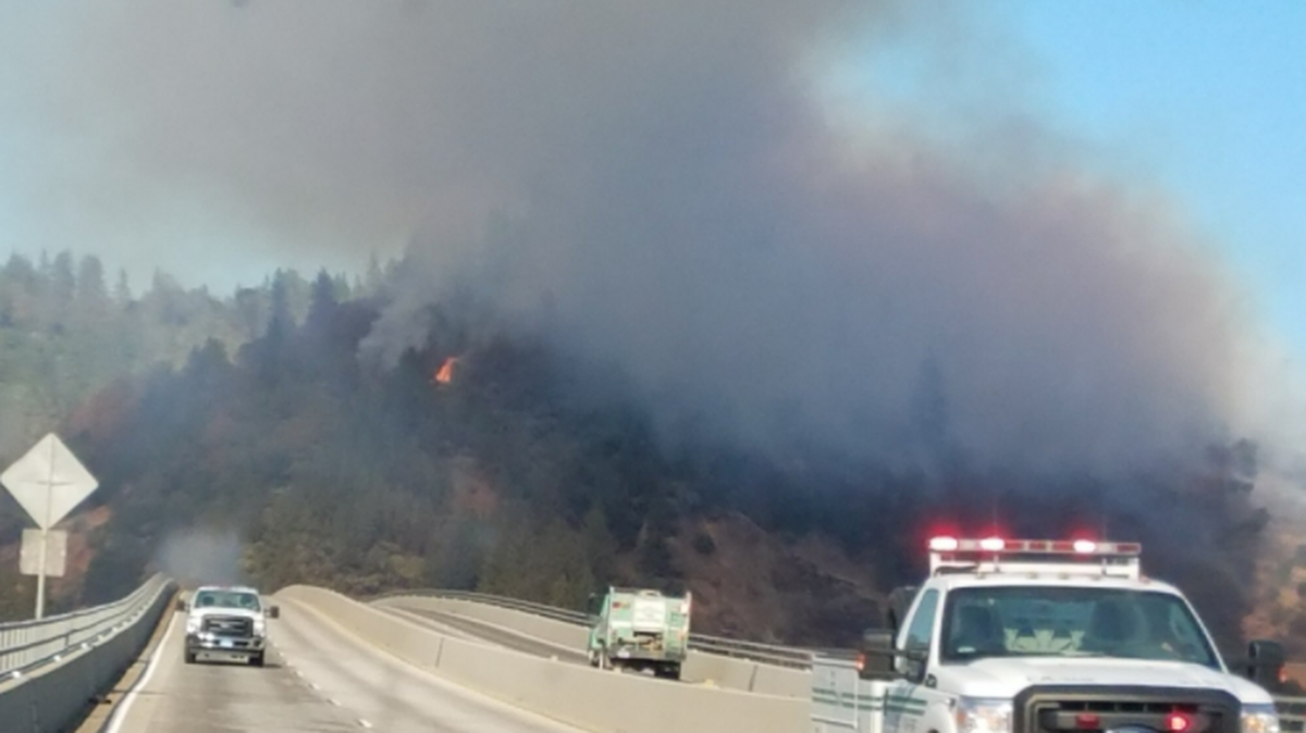 Brush and vehicle fires shut down a section of Interstate 5 near Shasta Lake on Tuesday, Oct. 31, 2017.