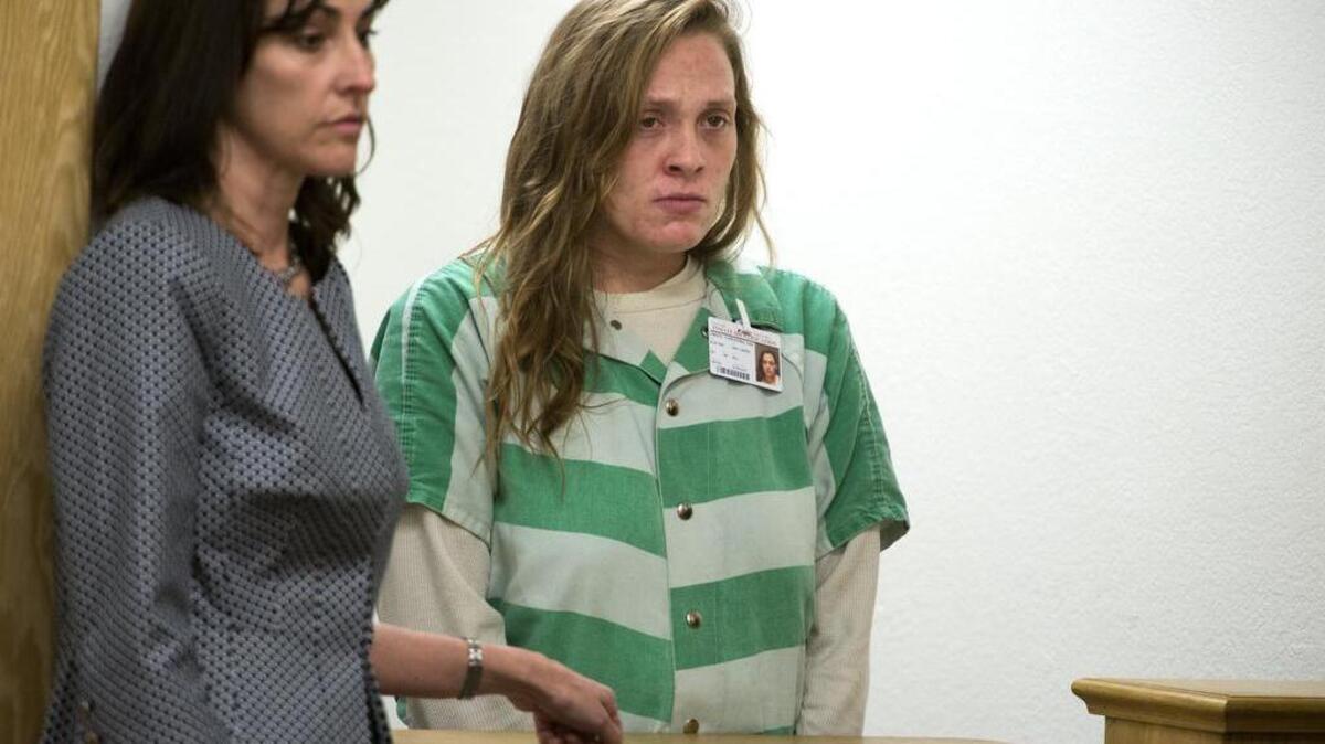 
Tracie Olsen, Yolo County public defender stands with Samantha Green the mother of three-week-old Justice Rees as she is arraigned on the child's death on Wednesday, March 4, 2015 in Woodland. Green plead not guilty to felony charges of involuntary manslaughter and abusing or endangering the health of a child.

