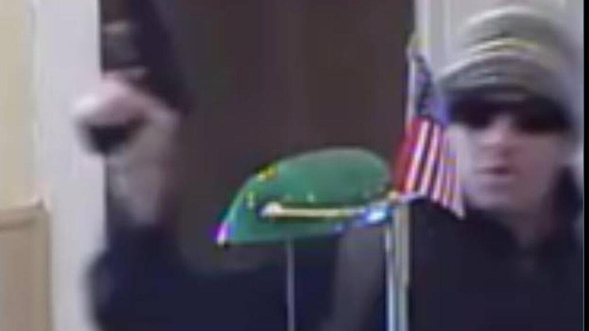 A security camera captured this image of the “Khaki Bandit” brandishing a weapon Tuesday at Yosemite Bank in Groveland.