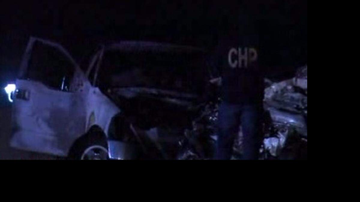 
A CHP officer takes photographs at the scene of Tuesday morning’s deadly wrong-way collision on I-80.
