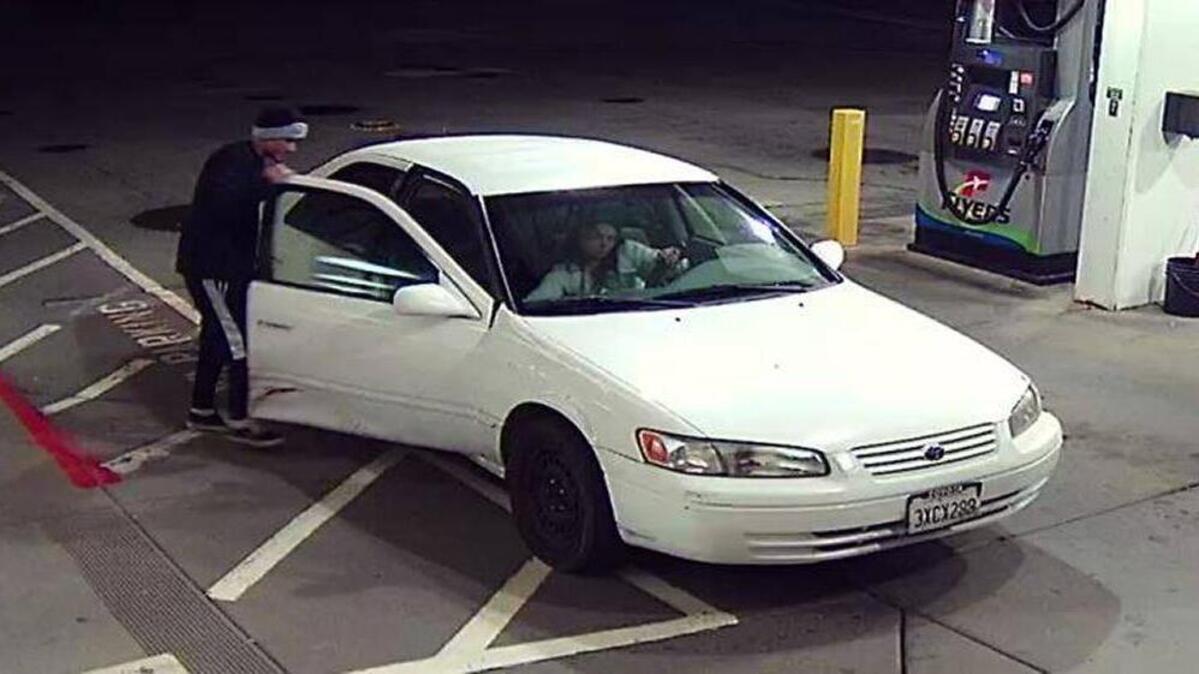 A surveillance photo shows a suspected armed robbery getting into a car at the Flyer’s gas station in Auburn.
