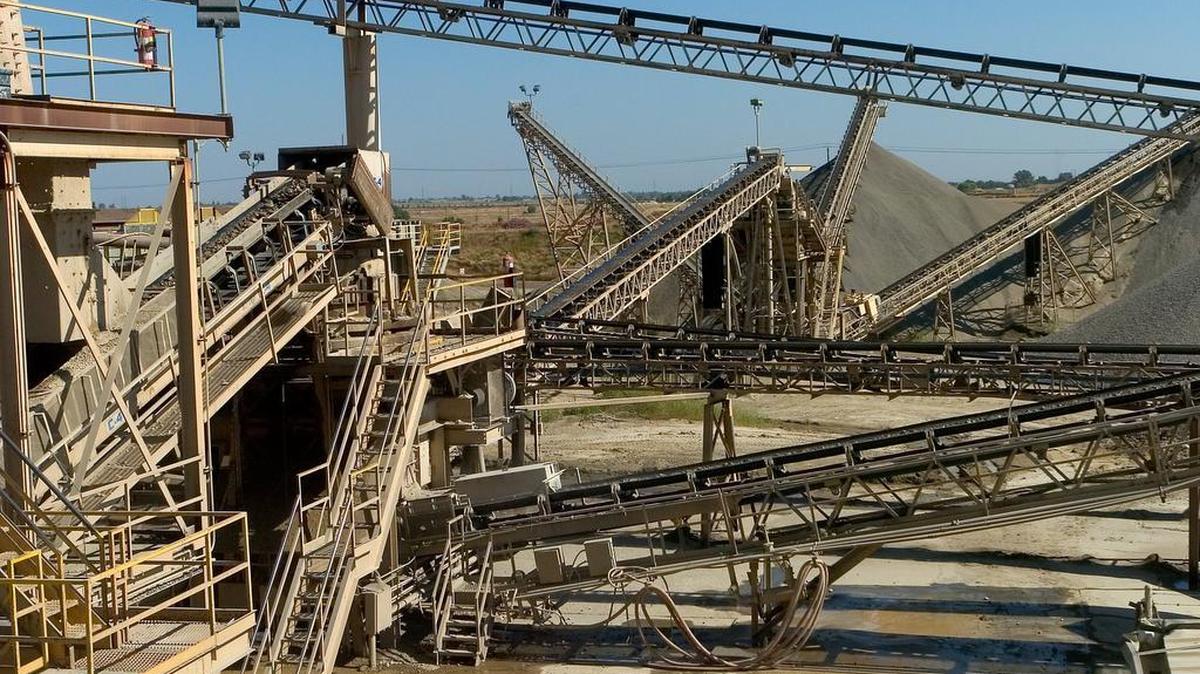 A maze of conveyor belts move rock and gravel throughout the processing area of Granite Construction Company near Bradshaw Road on June 19, 2006.