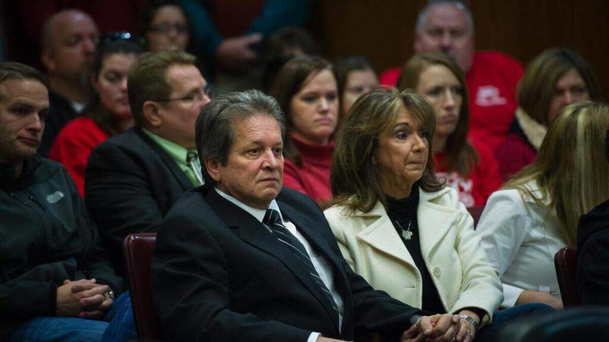 Bob Adams, owner and former principal of the Creative Frontiers School, sits with his wife Sandy and dozens of supporters in Sacramento Superior Court in 2011.