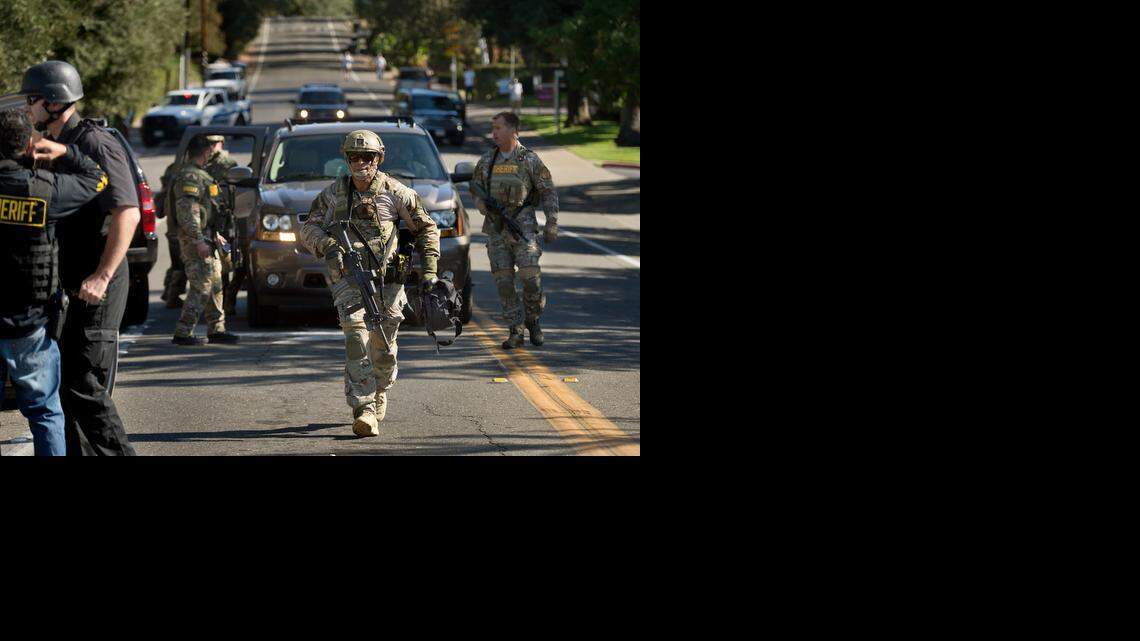 
Law enforcement officers respond to an officer-involved shooting at the intersection of Fair Oaks Boulevard and Van Alstine Avenue in Sacramento on Friday.
