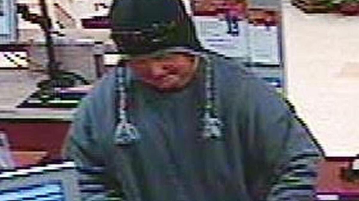 Man wanted in Hefty Heister robberies