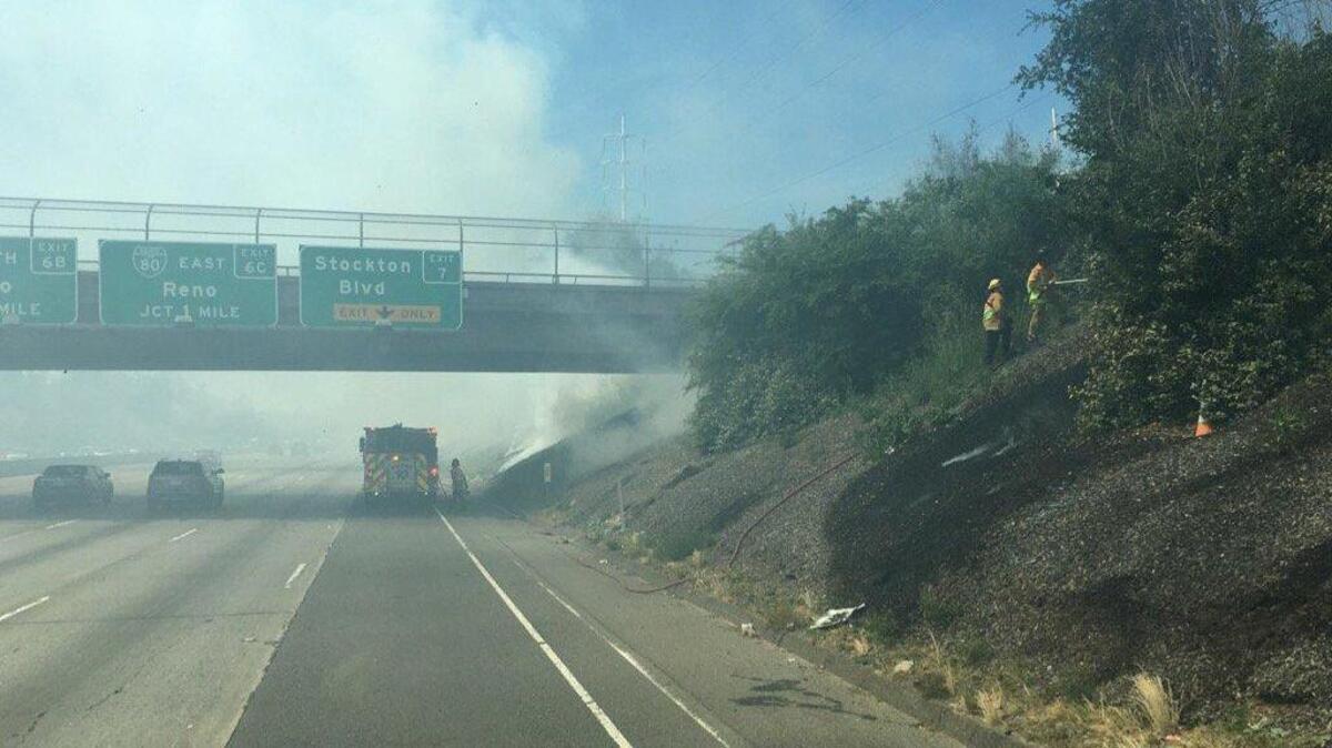 Fire crews work to extinguish small blazes Saturday afternoon along Highway 50 near Stockton Boulevard.