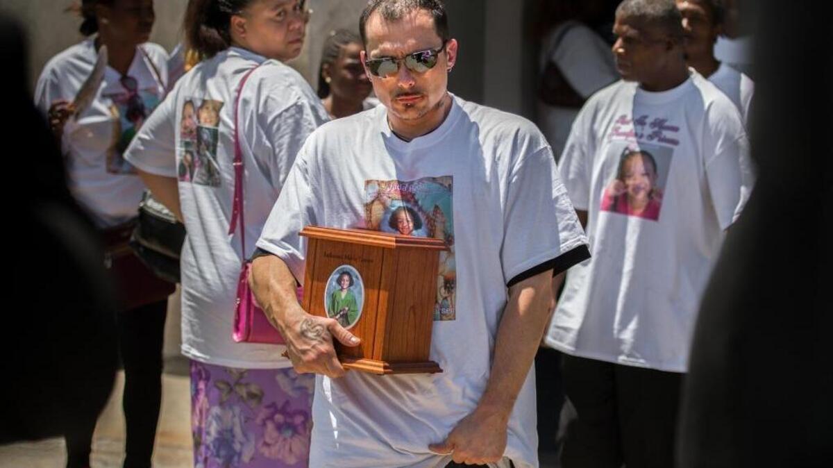 
Richard Larsen, father of slain 6-year-old Jadianna Larsen, leaves a funeral service July 17 in Sacramento with his daughter's ashes. Juan Rivera, 25, of Sacramento, boyfriend of Jadianna’s mother, Tenicia Clark, is being held without bail in the case.
