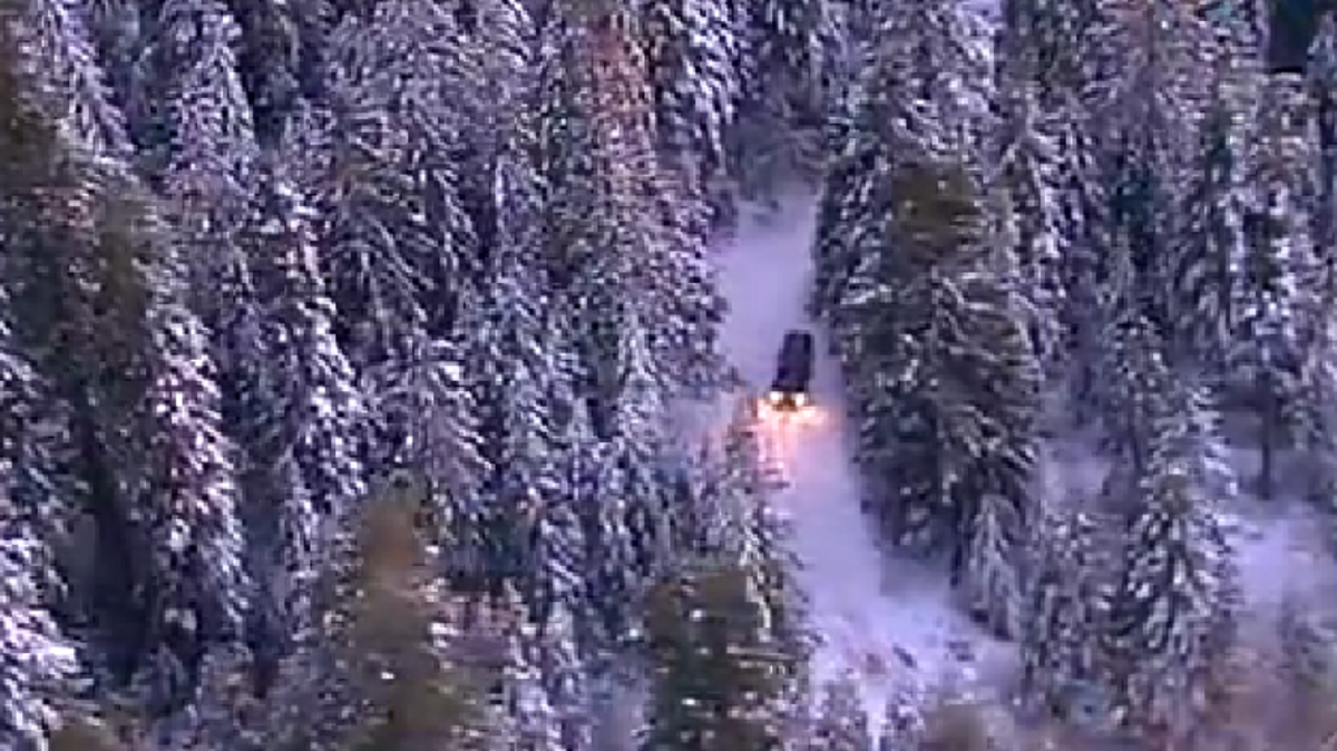 A CHP helicopter crew guided search and rescues teams to a vehicle stuck in the snow in rural Nevada County.