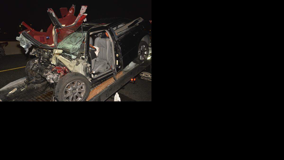 
A 2006 Chrysler 300 that was driven by Aaron Jordon Caudillo, according to the California Highway Patrol, is loaded onto a tow truck early Saturday. The Chrysler slammed into a Buick Regal on Interstate 80, killing Matthew Azar, 20, Kendra Langham, 18, and Mathew Beardwitt, 18. Caudillo was hospitalized and may face charges. 



