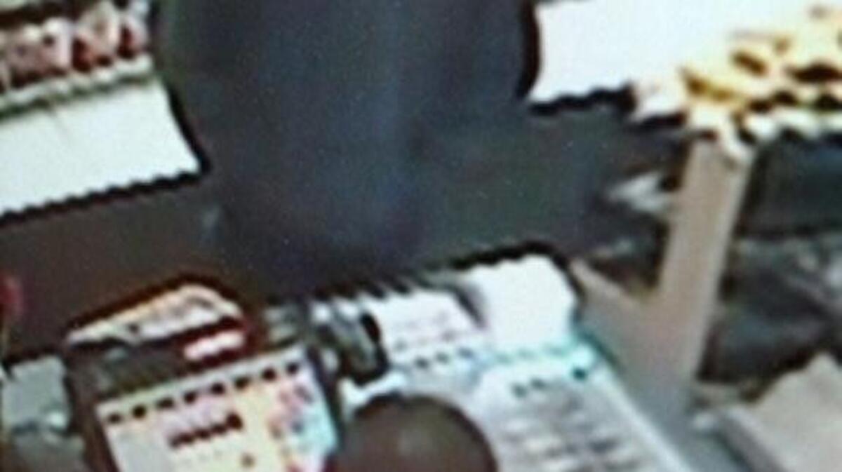 A surveillance photo shows a man sought in the robbery of a Rocklin store.