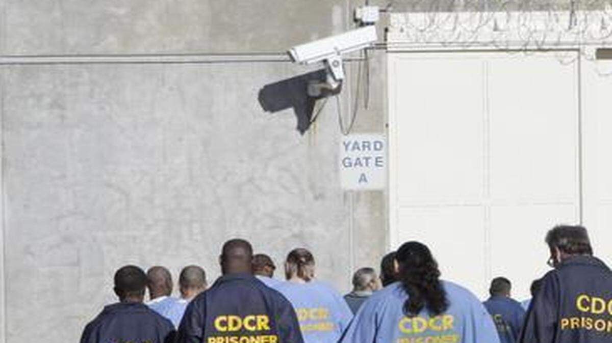 
Inmates walk through the exercise yard at California State Prison Sacramento, near Folsom, in 2013,  when federal judges gave California two more years to meet a court-ordered prison population cap, a limit that has been met more than a year early, officials say.
