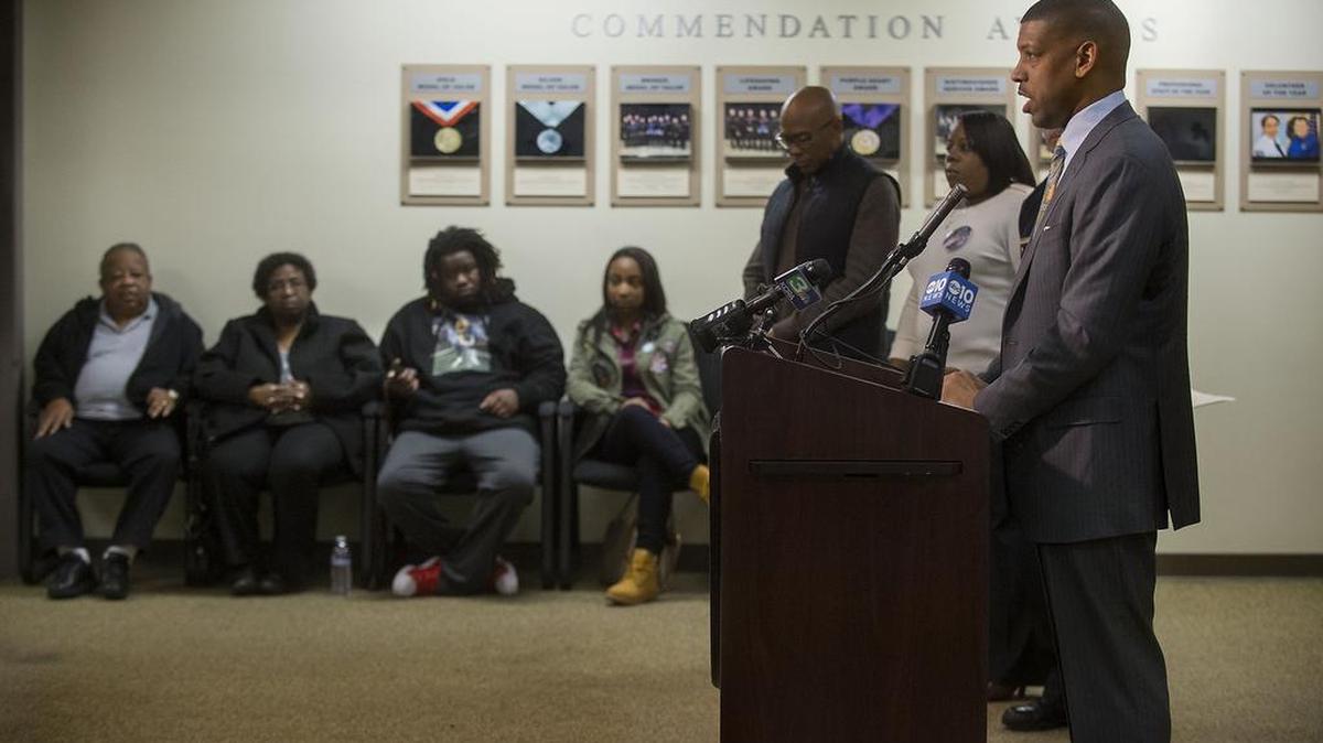 With victim's family members seated in the background, Sacramento Mayor Kevin Johnson speaks during a press conference at the Sacramento Police Department in Sacramento on Thursday, February 18, 2016.