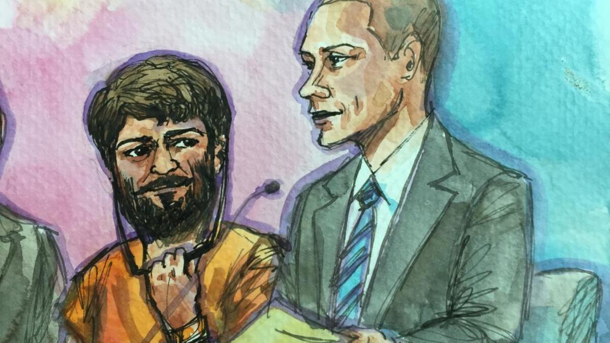 Aws Mohammed Younis Al-Jayab, 23, appears in court Jan. 22 with his attorney, Ben Galloway.