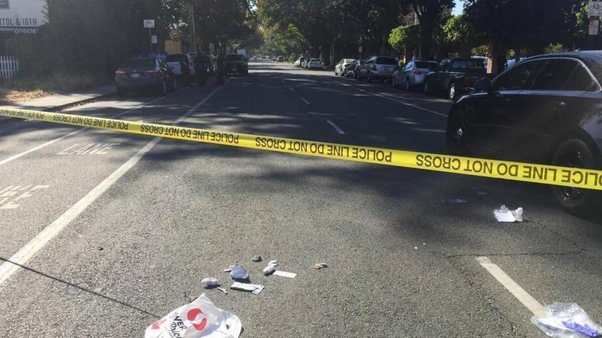 A plastic shopping bag, scraps of paper and other debris remain on 19th Street between Q and S streets in Sacramento after emergency responders took a man to a local hospital Oct. 24, 2017 after he was found unconscious in the street.