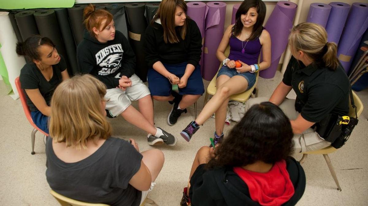 This picture from 2012 shows Sheriff's deputy Dana Vicory talking with Moreen Tate, 13, (back row from left) Megan Seger, 12, Maricella Lemert, 13, and Elaura Reyes, 14, in a "Girls' Circle" mentoring program for students at Albert Einstein Middle School. Vicory was assigned to the Youth Services Unit - the youth outreach and gang prevention arm of the Sacramento County Sheriff’s Department’s anti-gang division.