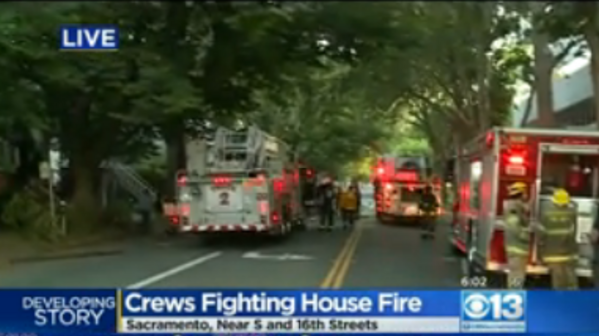 A fire at an abandoned home in midtown early Tuesday spread to a second home but there were no injuries.