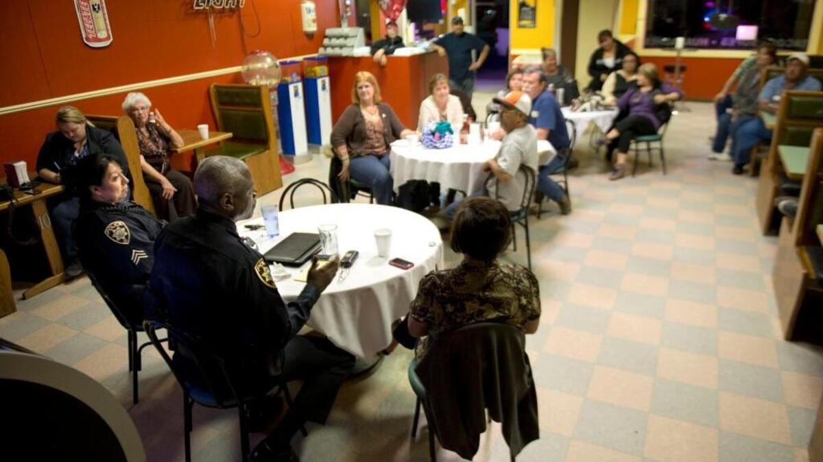 Dennis Hegwood, interim police chief in King City, talks to residents of King City during “Coffee with a Cop,” an event organized by Gerry Ramirez for community members to meet with the chief to ask him questions and concerns that they have about the community, on March 12, 2014 at El Huarache King in King City.