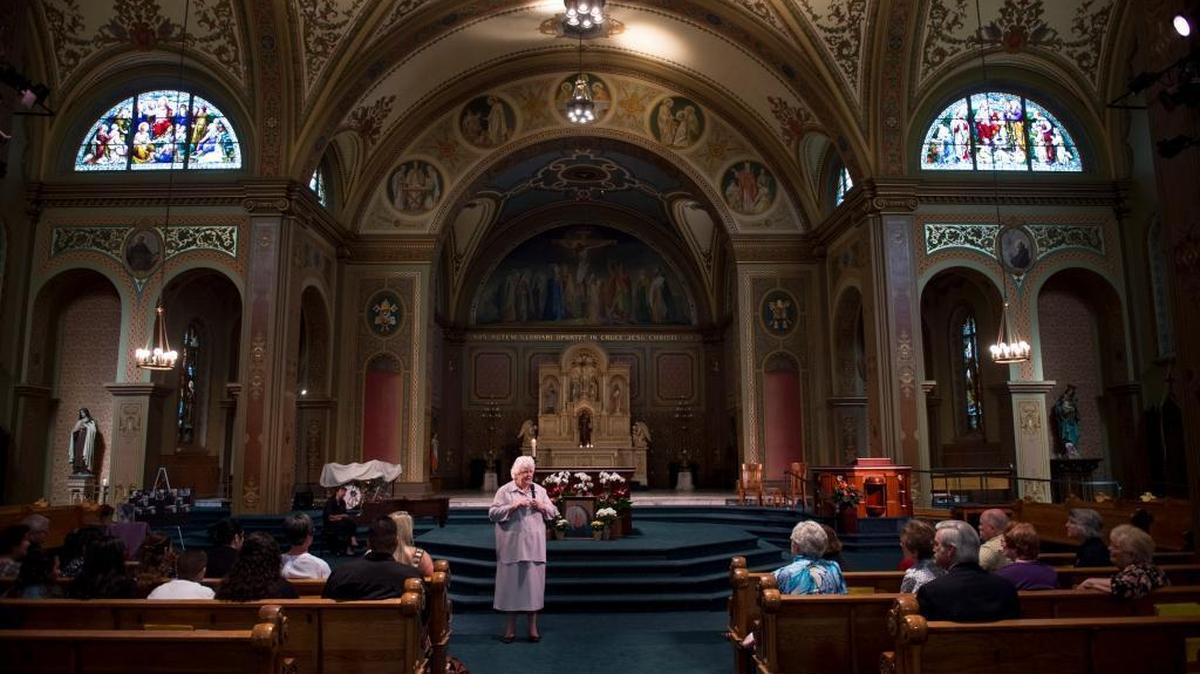 Sister Clare Graham shares stories about her schoolmate Genevieve "Genny" Lucchesi at a memorial at St. Francis of Assisi church in Sacramento in 2015.