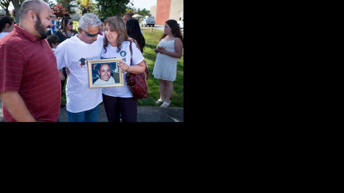 
Rodrigo Rodriguez, center, father of Rod Rodriguez Jr., a UC Berkeley student killed at a Sacramento barbershop in 2007, hugs Linda Effron, mother of the slain man’s girlfriend, Yvonne Natad. With them is her son, Vince Natad. They were attending the dedication ceremony for a new soccer field in Oak Park on Monday.
