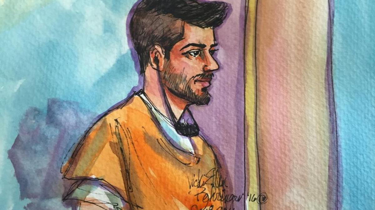 Listening through an Arabic interpreter, Aws Mohammed Younis Al-Jayab appears in Sacramento federal court Friday.