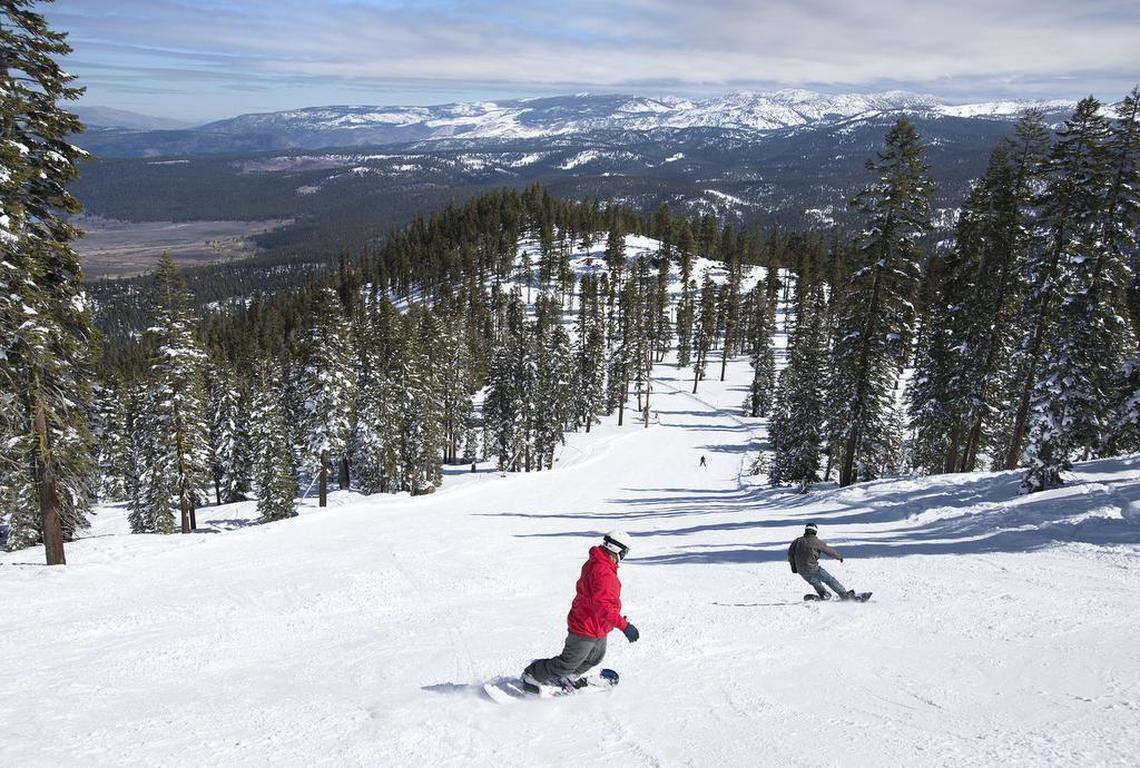 Snowboarders head down a run at Northstar ski resort on Tuesday, March 15, 2016 in Truckee, Calif.