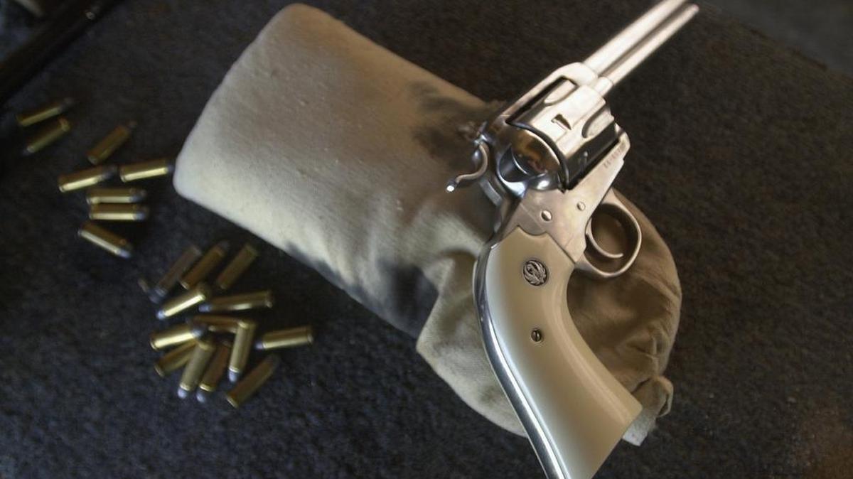 FILE - A .45 caliber revolver is ready to be fired at the Cordova Shooting Center in Sacramento on Wednesday, June 20, 2001.