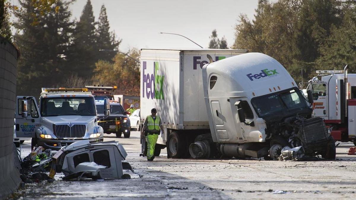 A northbound big rig sits in the southbound lanes after it crossed over the median on the rainy Interstate 5 striking a southbound pickup, killing its driver at Fruitridge Road and Seamas Avenue on Monday, December 10, 2015, in Sacramento.