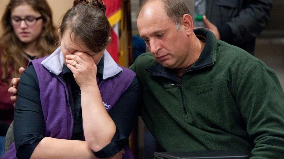 Nadezhda Oliferchik is comforted by her husband, Vyacheslav, in October 2012 in Sacramento as they attend a press conference for daughter Alina Bukhantsov, 23, who was brutally killed in her home along with children, Emmanuela, 3, and Avenir, 2.