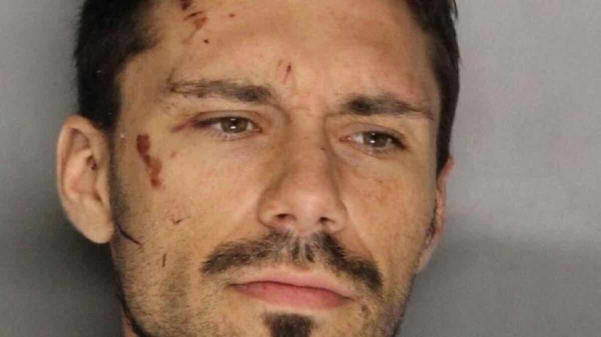 Eduard Kamilchu was booked on suspicion of attempted assault with a destructive/explosive device, arson, violation of a domestic violence restraining order and violation of probation.