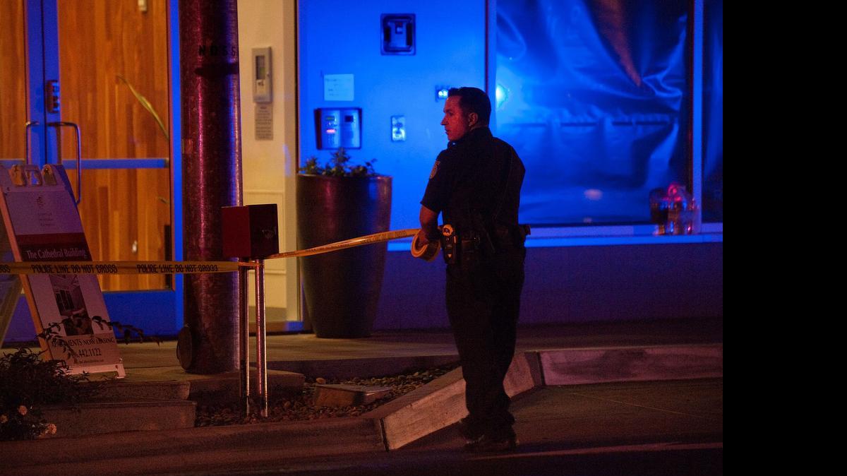 
An officer cordons off a shooting scene in Sacramento.

