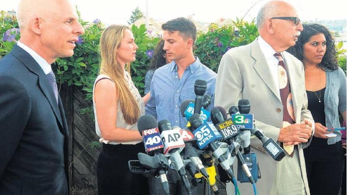 Denise Huskins and Aaron Quinn are flanked by their attorneys at a July 2015 Vallejo press conference.
