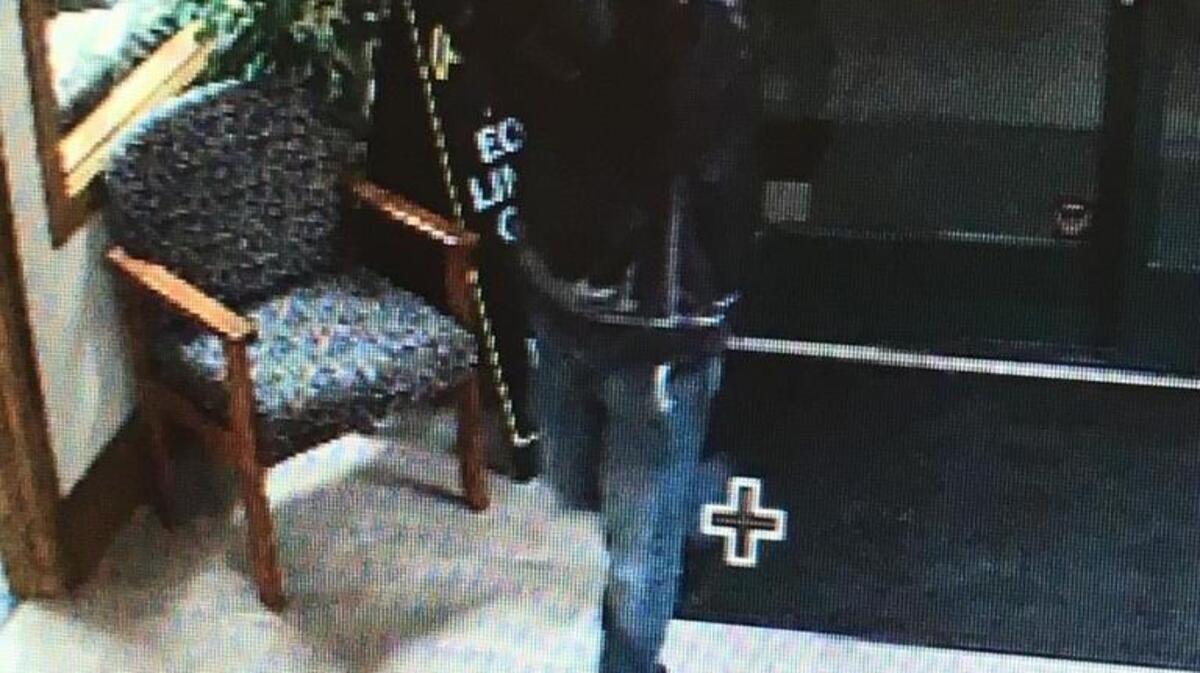 A surveillance photo shows a man sought in connection with the robbery of the El Dorado Savings Bank in Diamond Springs.
