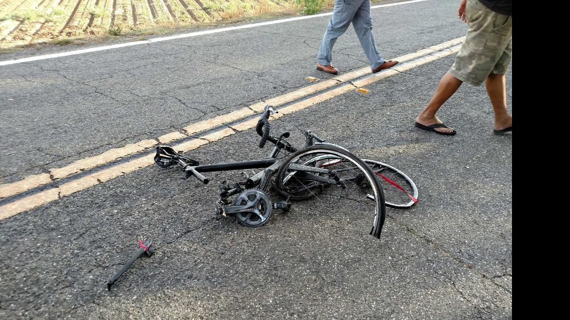 
Jonathan Jackson’s bike lies on the road after the 17-year-old cyclist was struck by a car Tuesday.
