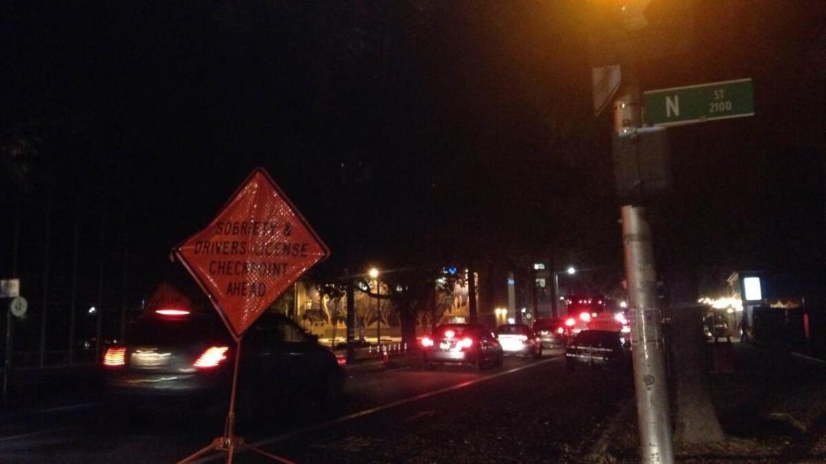 Cars line up for a sobriety checkpoint in midtown Sacramento on Wednesday night.