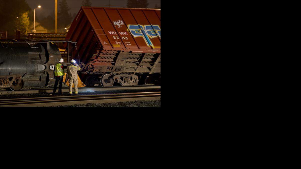 
Emergency crews check the cars in the rail yard where seven cars derailed near the Home Depot store in Antelope on January 5, 2015.
