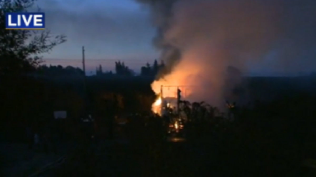 Crews battle a fire at a home in Courtland Thursday morning.