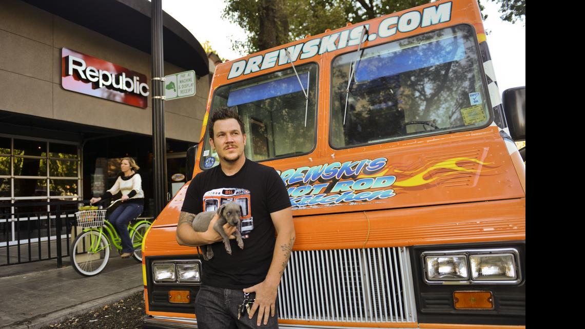 
Andrew “Drewski” Blaskovich is the owner of Drewski’s Hot Rod Kitchen and a partner of the restaurant and bar, Republic, featuring food by Drewski’s Hot Rod Kitchen. He’s pictured holding his mascot, a Great Dane puppy named Rex, in October 2012. Blaskovich arrived home Saturday to find his dog shot dead and his house ransacked. 

