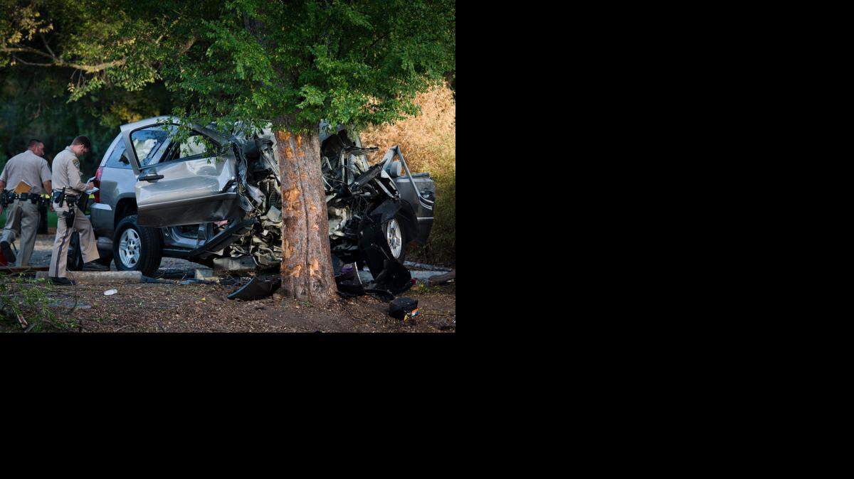 
This SUV hit a tree after killing a woman riding a bicycle. Witnesses said the driver lost control while trying to go around a car stopped at a light. Both women in the SUV were killed.
