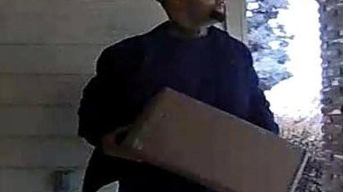 Roseville police seek to identify this man shown in surveillance photos taking a package from a home on Vista Creek Drive on Nov. 25.