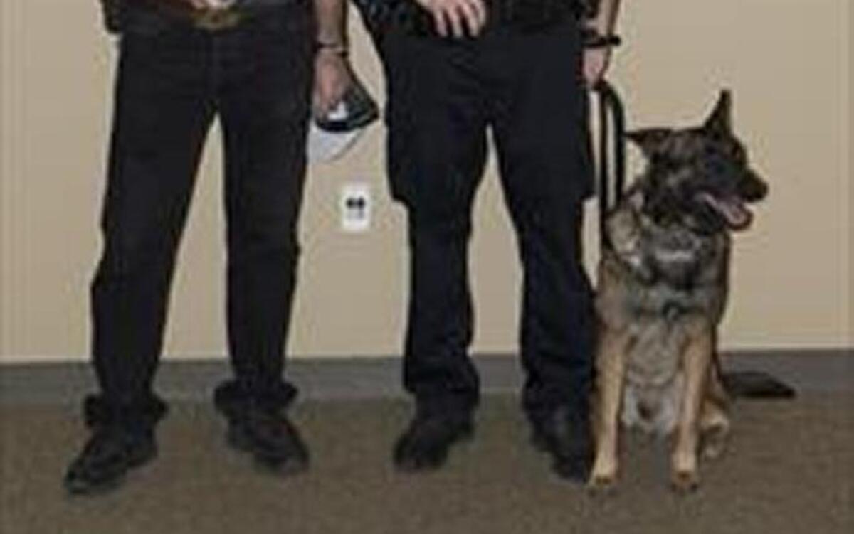 Officer Scott Harshbarger is shown with his new K-9 partner, Finn, and Bill Bean Sr., father of Sacramento police officer William C. Bean Jr., who was slain during a traffic stop in 1999. The William C. Bean Memorial Foundation donated funds for the new police dog.